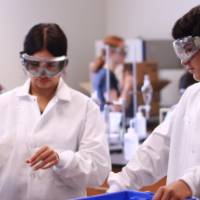 students interacting during a chemistry experiment